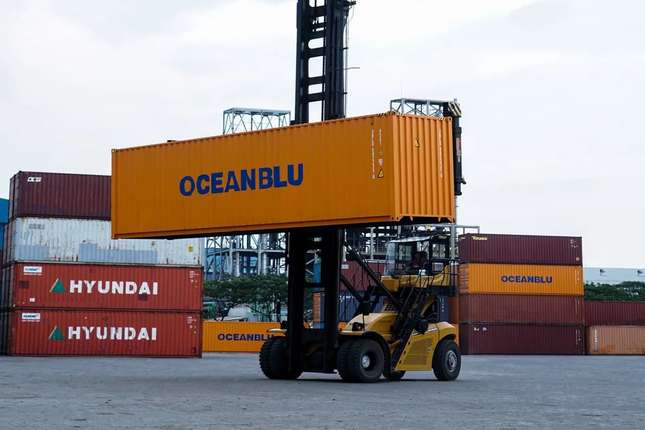 Container handler loading a 40-foot container at a terminal